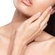 Beauty closeup of young woman hand touching face... (thumbnail)
