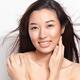 Beautiful young smiling asian woman with flying hair... (thumbnail)