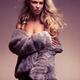 Glamour photo of beautiful woman in fur coat over naked body Charlie R... (thumbnail)