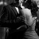 Beautiful portrait of couple standing near window on rainy night black... (thumbnail)