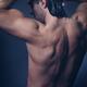 Portrait of man with wet bare torso in shower... (thumbnail)