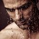 Pensive man face under showering water... (thumbnail)