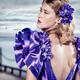 Beautiful blond woman in blue dress with open back... (thumbnail)