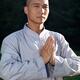 Portrait of a Shaolin warrior monk with folded hands... (thumbnail)
