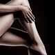 Closeup of Bare Woman Legs on Black Background... (thumbnail)