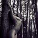 Artistic bodyscape of nude woman leaning against pine tree... (thumbnail)