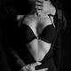 Beautiful sensual portrait of a couple. Man hands undressing a woman.... (thumbnail)
