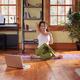 Young woman practicing yoga in a living room... (thumbnail)