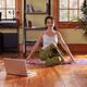 Woman doing yoga at home in living room... (thumbnail)
