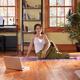 Woman doing yoga exercise on a living room floor... (thumbnail)