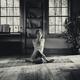 Woman in artistic meditative yoga posture... (thumbnail)