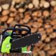 Electric Cordless Chainsaw by stacked firewood... (thumbnail)