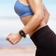 Woman jogging outdoors with Apple Watch on her wrist... (thumbnail)