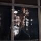 Woman face behind reflections on the window pane... (thumbnail)