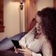 Woman at home using iPhone 7 Plus smartphone... (thumbnail)