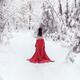 Woman in red kimono and bare shoulders walking away in snow... (thumbnail)