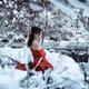 Woman in red kimono with bare shoulders in winter scenery... (thumbnail)