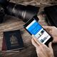 Hands with iPhone 7 displaying flight information... (thumbnail)