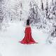 Woman in red kimono and bare shoulders walking away in snow... (thumbnail)