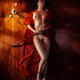 Beautiful nude woman in red kimono lying on floor... (thumbnail)