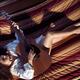 Woman playing the guitar in a hammock at home... (thumbnail)