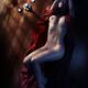Beautiful nude woman lying on wood floor in dim dramatic light... (thumbnail)