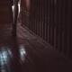 Woman walking barefoot in dark house Closeup of legs... (thumbnail)