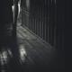 Woman walking barefoot in dark house Closeup of legs Black and white... (thumbnail)