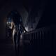 Woman walking in underwear at night on staircase of house... (thumbnail)