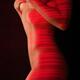 Woman naked body with red laser stripes on skin... (thumbnail)