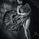 Sensual portrait of woman in dress with bare legs lying on the floor B... (thumbnail)