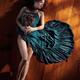 Sensual portrait of woman in green dress with bare legs lying on the f... (thumbnail)