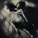 Artistic portrait of woman in dress with flower in dynamic leap vintag... (thumbnail)