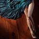 Sexy woman legs and green dress on wooden floor... (thumbnail)