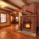 Timberframe Canadian house interior living room with burning fireplace... (thumbnail)