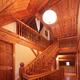 Timber frame cottage style Canadian house wooden staircase leading to... (thumbnail)