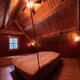 Loft bedroom with hanging bed in timberframe Canadian house... (thumbnail)