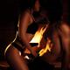 Sensual artistic photo of couple making love in front of fireplace... (thumbnail)