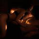 Beautiful sensual couple making love in front of fireplace... (thumbnail)