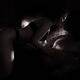 Beautiful sensual couple making love in front of fireplace Black and w... (thumbnail)