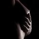 Artistic closeup of nude woman breast with her hand under it... (thumbnail)