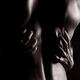 Artistic nude abstract of man back with woman hands on it... (thumbnail)