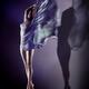 Beautiful woman flying wrapped in flowing cloth while shadow of her bo... (thumbnail)