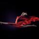 Beautiful woman in red flame like flowing cloth around her body making... (thumbnail)
