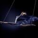Beautiful naked woman suspended in a split with bondage ropes with flo... (thumbnail)