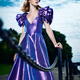 Artistic fashion portrait of woman in beautiful long blue dress at a p... (thumbnail)