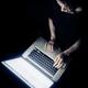 Woman face lit by the laptop screen light... (thumbnail)