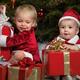 Kids Opening Gifts under a Christmas Tree... (thumbnail)