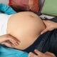 Pregnant Woman Being Inspected by a Midwife... (thumbnail)