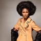Fashion beauty portrait of a black african model wearing a coat with f... (thumbnail)